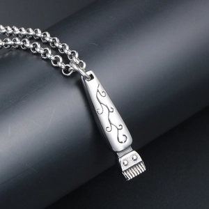 Vintage punk titanium steel necklace featuring a barber clipper pendant with ornate engraving