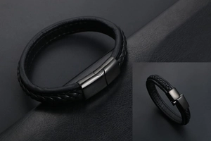 Détail d'un bracelet en cuir tressé noir pour homme avec fermoir magnétique en métal