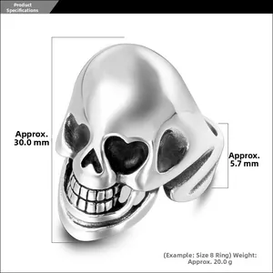 Detail view of vintage punk skull ring with heart-shaped eyes and size measurements