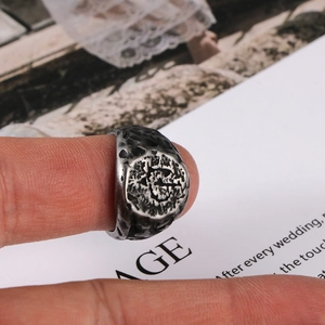 Retro mens stainless steel signet ring with irregular hammered texture on fingers
