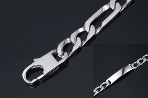 Detailed macro view of silver Figaro chain with lobster clasp and engravable ID plate