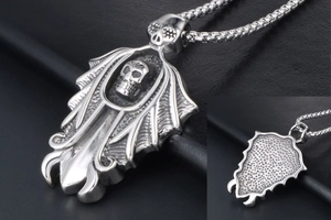 Macro view of gothic skull pendant with detailed relief and honeycomb back texture