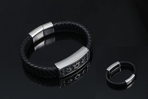 Close-up of black braided leather bracelet with stainless steel Star of David metal plate