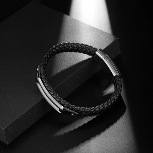 Minimalist men's braided leather bracelet with a polished silver magnetic metal clasp