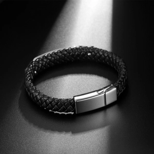 Braided leather motorcycle bracelet with polished magnetic clasp in cinematic lighting