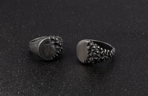 Detail of vintage men's ring with asymmetrical smooth finish and rock texture surface