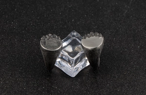 Macro detail of vintage men's stainless steel rings with unique rock texture finish