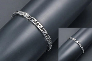Detail view of silver geometric hollow link chain bracelet for men with smooth clasp