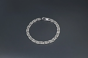 Detailed view of silver stainless steel curb chain with interlocking C links and lobster clasp