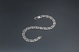 Detailed view of silver stainless steel chain bracelet with interlocking dual rings