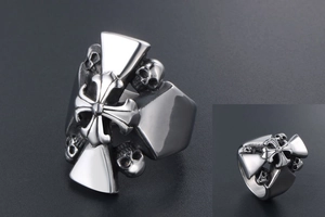 Macro shot of gothic cross ring with skull details in vintage titanium steel finish