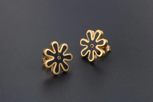 Detail of daisy stud earrings with black enamel petals and red zircon center