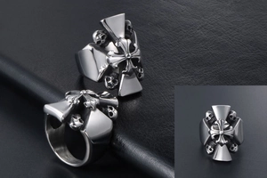 Detail view of gothic titanium steel ring with cross totem and skull reliefs