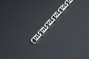 Detailed macro view of interlocking silver titanium steel links with a polished finish