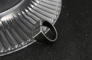 Macro detail of men's vintage titanium steel ring with unique cracked scale textures