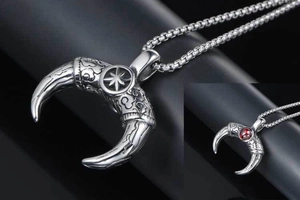 Detailed relief patterns and red ruby inlay on vintage titanium steel horn pendant