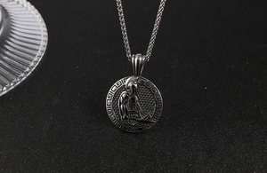 Close-up of vintage Spartan warrior pendant with Greek key pattern on steel chain