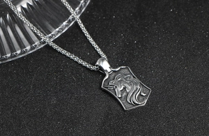 Close-up of vintage unicorn pendant on spiga chain with retro silver and black finish