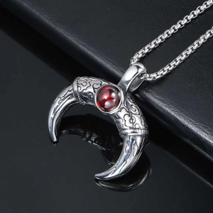 Retro titanium steel horn pendant with red gemstone and intricate cloud pattern