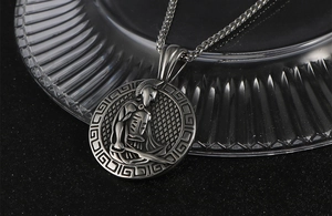 Macro shot of vintage Spartan warrior pendant with Greek key pattern on wheat chain