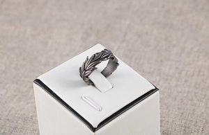 Detailed view of vintage silver steel ring with intricate wheat ear engraving textures
