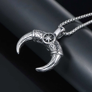 Retro stainless steel Mayan horn pendant necklace with ornate star engraving and ruby