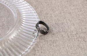 Macro detail of vintage silver men's ring showing embossed wheat ear pattern and aged texture