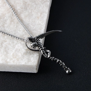 Macro view of Gothic grim reaper skull pendant with detailed stainless steel textures