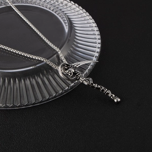Gothic grim reaper scythe skull pendant in retro silver finish on a sturdy wheat chain
