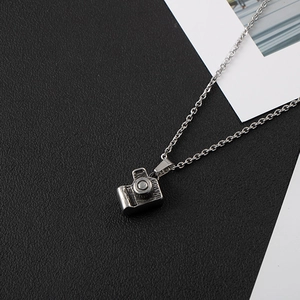 Elegant stainless steel necklace featuring a creative vintage camera shaped pendant