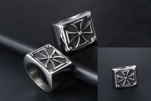 Close-up of men's square stainless steel signet ring with black embossed iron cross