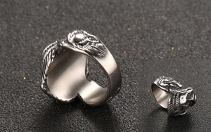 Detailed macro view of retro eagle head titanium steel ring with intricate feather texture
