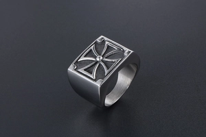 Macro detail of men's vintage titanium steel ring featuring an engraved cross design