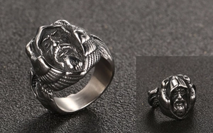Detailed view of vintage titanium steel ring featuring a wizard face and wing reliefs