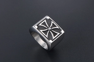 Macro detail of men's stainless steel signet ring with black Iron Cross design