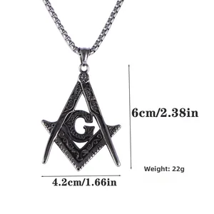 Detailed macro view of vintage Masonic compass pendant with scroll engraving and dimensions