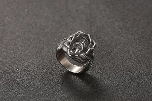 Macro shot of retro stainless steel men's ring with detailed bearded character carving