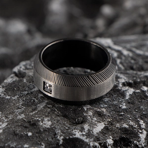 Mens industrial stainless steel ring with center diamond and black textured details