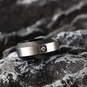 Industrial style stainless steel men's ring with brushed finish and center cubic zirconia