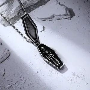 Gothic punk coffin necklace in stainless steel with hidden skeleton inside on stone