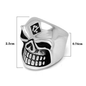 Macro view of polished stainless steel skull ring with 1% engraving and size dimensions