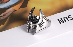 Macro detail of retro stainless steel Batman ring with vintage finish and gothic textures