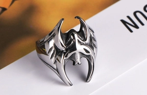 Close-up of vintage silver gothic batman ring with detailed textured bat wings
