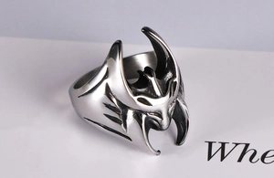 Macro detail of retro vintage batman-style titanium steel ring with polished finish
