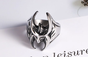 Macro detail of gothic batman wing ring with vintage oxidized steel finish