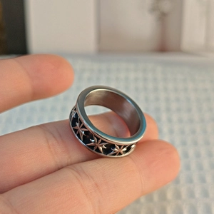 Vintage punk titanium steel ring featuring an oxidized black hexagram star pattern