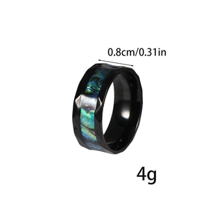 Detail view of 8mm black stainless steel ring with colorful abalone shell inlay