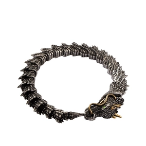 Vintage punk dragon head bracelet in silver and gold with intricate scale texture