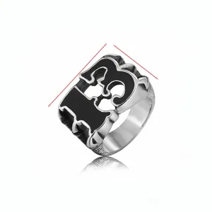 Macro view of vintage silver steel ring with black enamel number 13 on the top