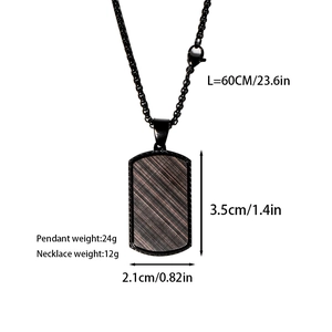Detail of black rectangular pendant necklace with diagonal brushed metal texture